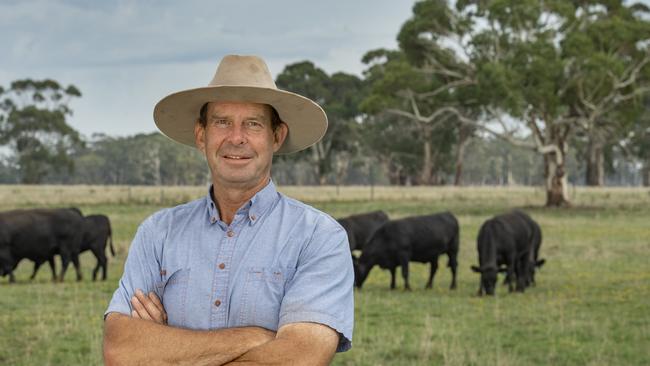 Mark with some of his Angus cattle in the background.