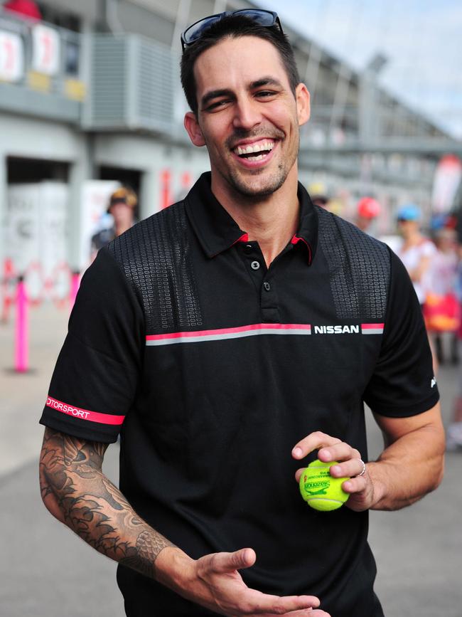 Townsville 400 2013. Australian cricketer Mitchell Johnson plays backyard cricket at pit lane.