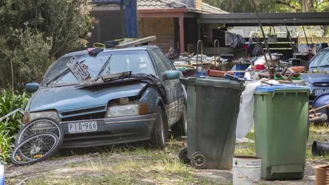 Junk piled up in the front yard of a home in Collision Rd, Cranbourne. Picture: Valeriu Campan