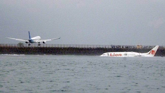 The wreckage a crashed Lion Air plane sits on the water near the airport in Bali, Indonesia.