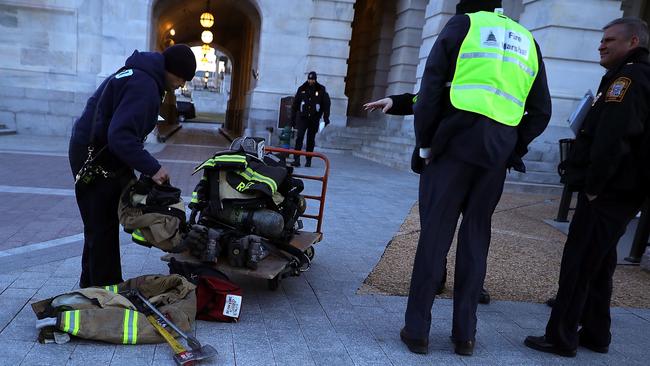 Firefighters prepare their gear outside the US Capitol. Picture: AFP