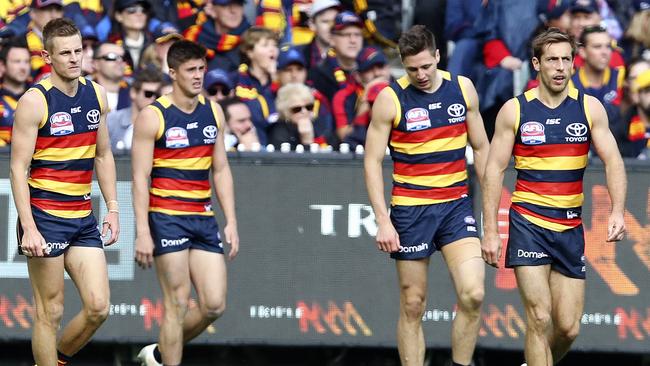 David Mackay, Riley Knight, Jake Kelly and Richard Douglas after the final siren in the grand final on Saturday. Picture: Sarah Reed.                        <a capiid="d04e3d316491442037f609df3676192f" class="capi-video">How Rance exposed Crows</a>