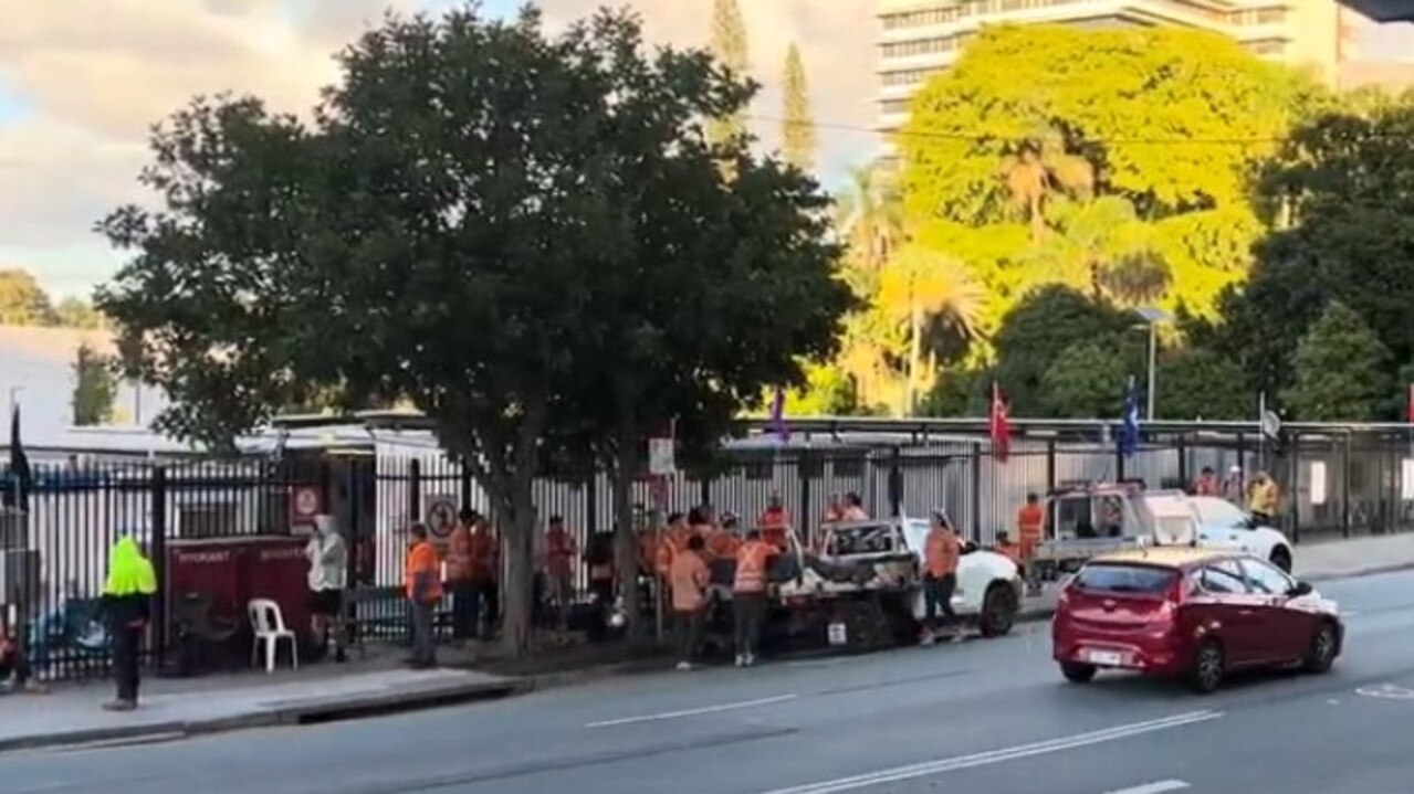 Up to 30 union workers were gathered outside the Exhibition Station Cross River Rail site by 7am, with vehicles parked along a restricted lane of O’Connell Tce.