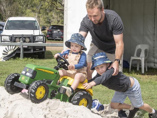 Beau and Parker Cowan have fun with their dad Scott Cowan in the play area. Toowoomba Royal Show. Friday, March 31, 2023. Picture: Nev Madsen.