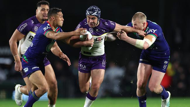 AUCKLAND, NEW ZEALAND – JUNE 15: Jahrome Hughes of the Storm is tackled during the round 15 NRL match between New Zealand Warriors and Melbourne Storm at Go Media Stadium Mt Smart, on June 15, 2024, in Auckland, New Zealand. (Photo by Phil Walter/Getty Images)