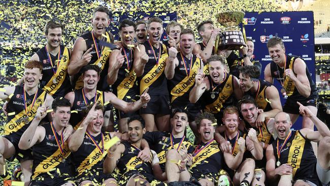 Glenelg players celebrate their premiership win on Sunday. Picture SARAH REED