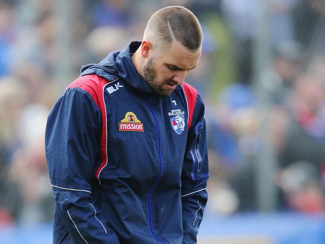 MELBOURNE, AUSTRALIA - SEPTEMBER 29: Matthew Suckling of the Bulldogs, in doubt to play with an achilles injury, looks down at his leg during the Western Bulldogs AFL media opportunity and training session at Whitten Oval on September 29, 2016 in Melbourne, Australia. (Photo by Michael Dodge/Getty Images)