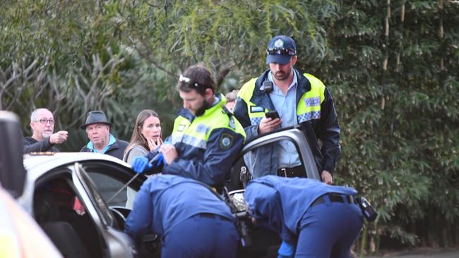 Paramedics treating Dunne. Picture: Sebastien Dekker