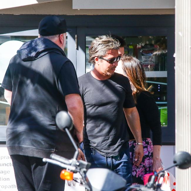 John Ibrahim and Kyle Sandilands leave a Sydney Cafe on Wednesday, a day after Ibrahim’s home was raided by police. Picture: MATRIX