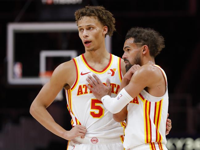 ATLANTA, GEORGIA - DECEMBER 2: Trae Young #11 and Dyson Daniels #5 of the Atlanta Hawks interact during the fourth quarter against the New Orleans Pelicans at State Farm Arena on December 2, 2024 in Atlanta, Georgia. NOTE TO USER: User expressly acknowledges and agrees that, by downloading and or using this photograph, User is consenting to the terms and conditions of the Getty Images License Agreement. (Photo by Todd Kirkland/Getty Images)