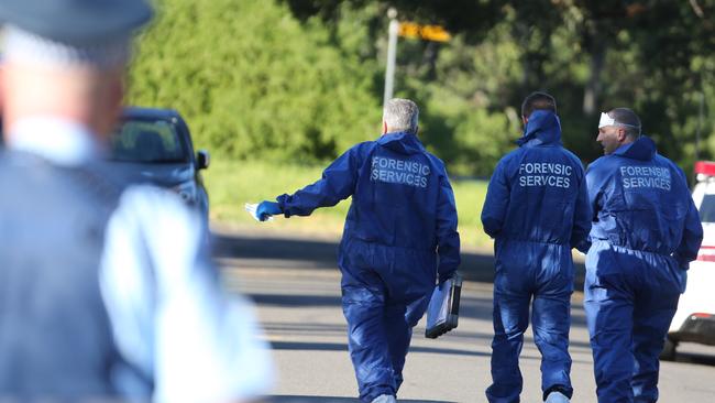 Police outside the Glenfield home where Brayden was shot two years ago. Picture: John Grainger