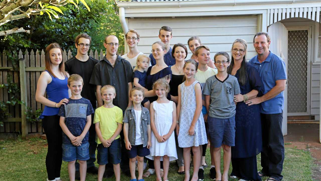 BIG CHRISTMAS: Enjoying their new PS4 are Bonell family (back row from left) Natalie, Karl, Jesse, Samuel, Katelyn, Claire, Cameron, Brooke, Sabrina, Timothy, parents Jeni and Ray Bonell and (front row from left) Nate, Eric, Damian, Rachel, Eve and Brandon. Picture: PlayStation Australia