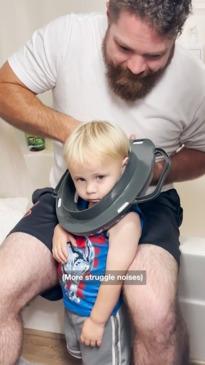 Toddler gets head stuck in toilet seat