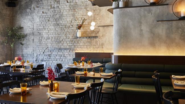 A moody dining room sets the scene at Copycat. Picture: Parker Blain