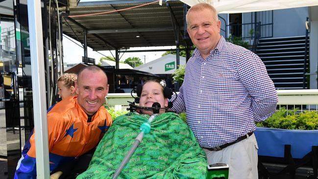 Glen Boss with Abbie Sweeper and her dad Russell after Abbie Sweeper won at Doomben. Picture Trackside Photography