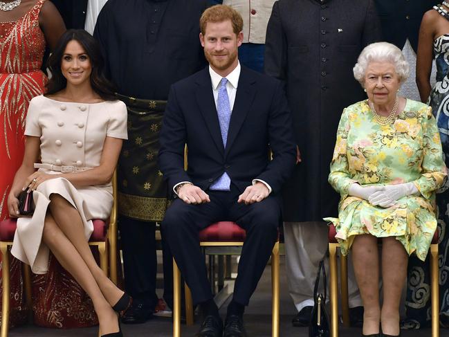 Meghan Markle, Prince Harry and the Queen. A statement issued by the pair said they intend to "balance" their time between the UK and North America. Picture: AP