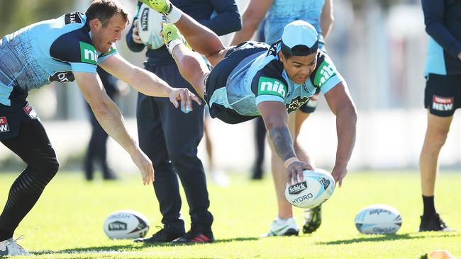 Latrell Mitchell dives for during NSW State of Origin training this week. Picture: Phil Hillyard