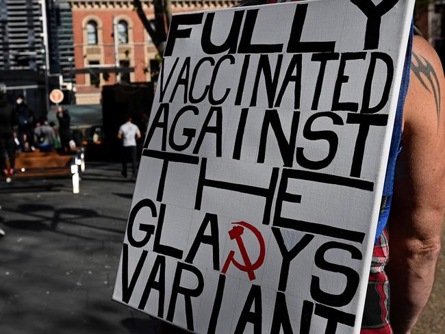 SYDNEY, AUSTRALIA - NewsWire Photos - JULY, 24, 2021: Protestors hold placards at Town Hall during a protest to rally for freedom of speech, movement, choice, assembly, and Health in Sydney. Picture: NCA NewsWire/Bianca De Marchi