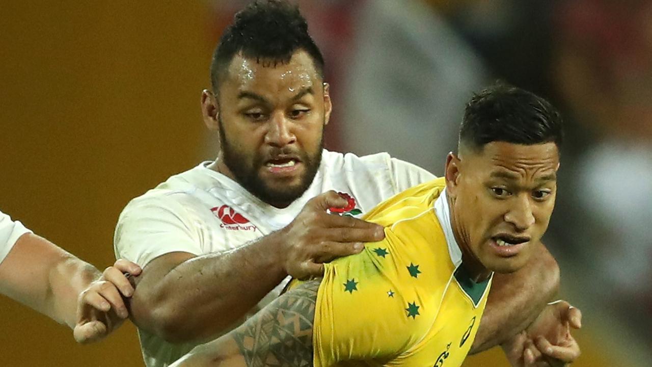 Israel Folau of Australia is held by Billy Vunipola at Suncorp Stadium.