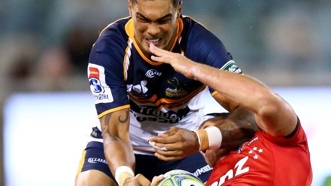 Israel Dagg of the Crusaders is tackled high by Chance Peni of the Brumbies.