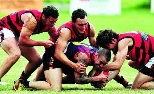 Luke Brauer, being tackled, says the Tigers are excited at the prospect of getting back on the winners’ list. Picture: Geoff Potter