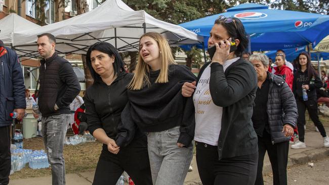 Relatives and survivors walk outside a hospital in the town of Kocani, North Macedonia. Picture: Visar Kryeziu