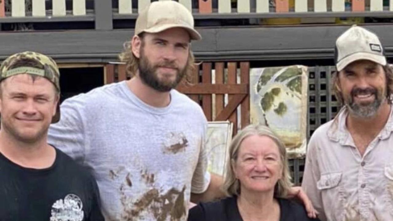 Luke and Liam Hemsworth, brothers of Thor star Chris, and former tennis champion Pat Rafter, reportedly worked all day helping clean up flood-ravaged homes in Lismore.