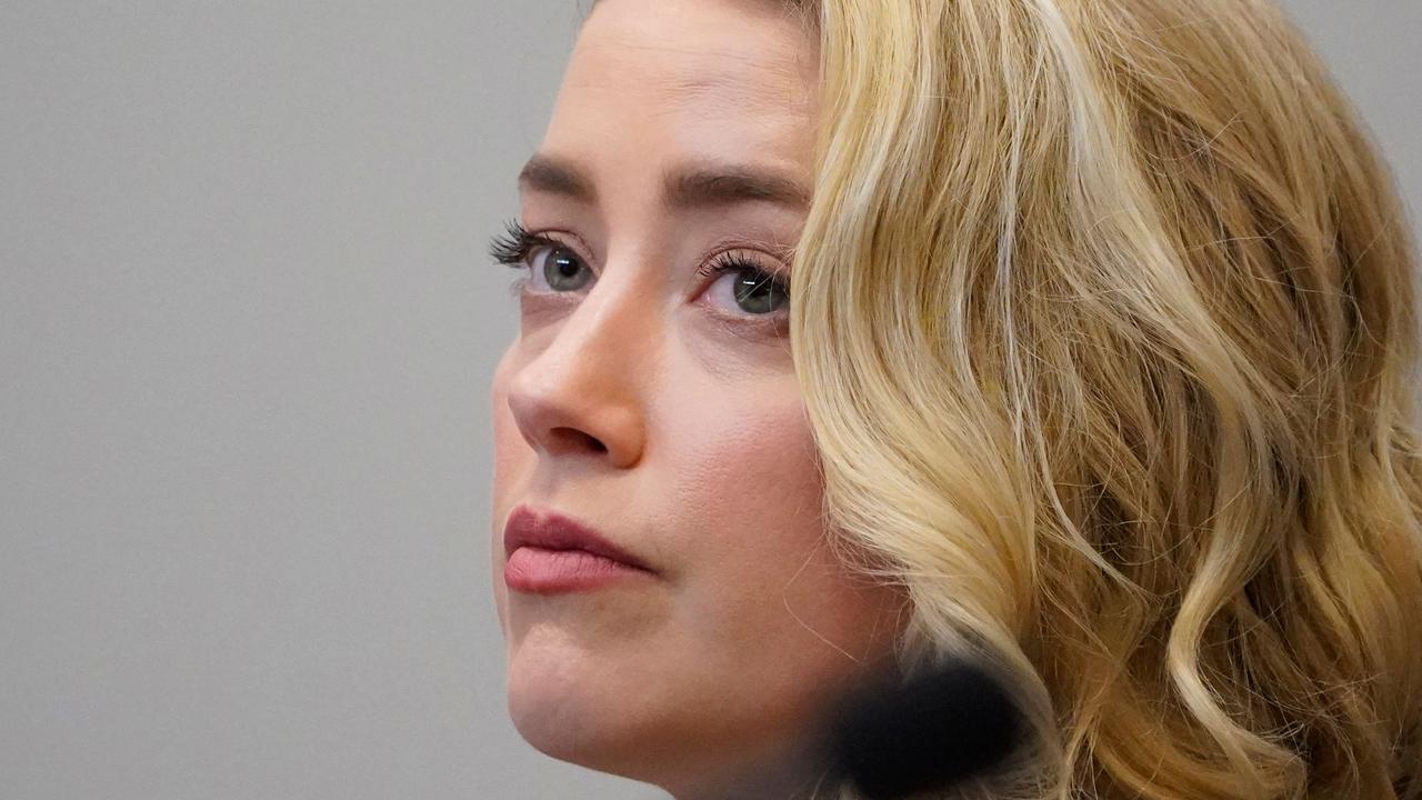 Amber Heard listens in court on Monday. (Photo by Steve Helber / POOL / AFP)