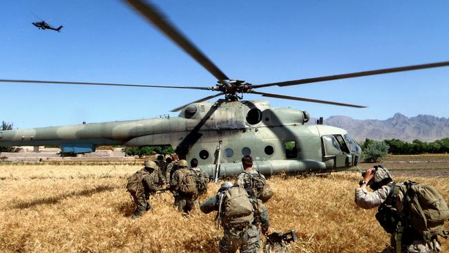 Australian soldiers board an Afghanistan Mil Mi-8 helicopter in Oruzgan province in 2011. Picture: Department of Defence