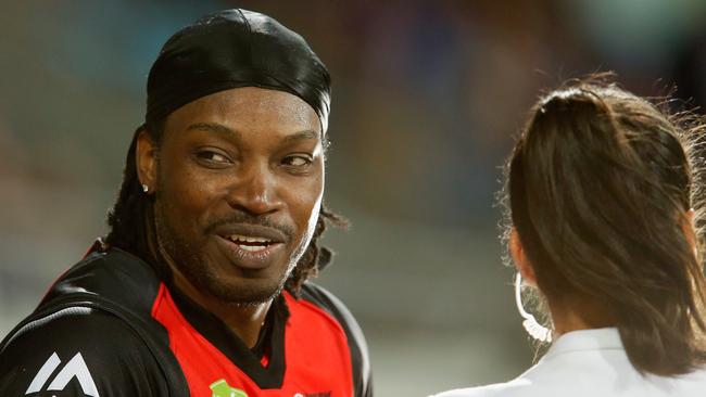 Chris Gayle of the Melbourne Renegades gives a TV interview to Mel Mclaughlin.