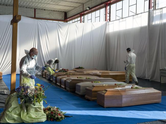 Eighteen coffins wait to be transported by the Italian Army to be cremated in Florence. Italy has been hard hit by COVID-19. Picture: Marco Di Lauro/Getty