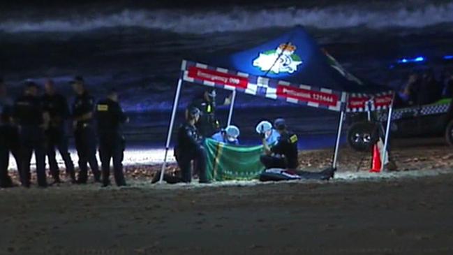 Police at the scene where a Baby body was found on Gold Coast beach - Photo Supplied CH 7