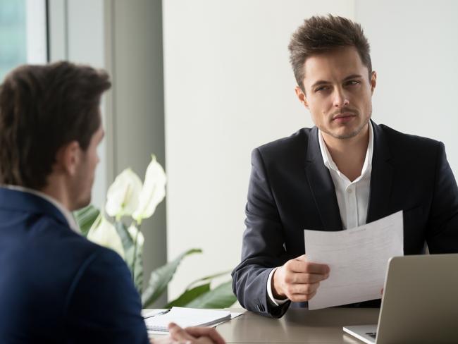 Distrustful businessman holding document at meeting, looking at partner with doubt suspicion, recruiter reads bad resume, caught applicant being dishonest at job interview, shady deal, contract fraud