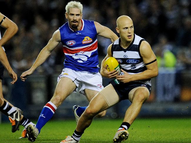 <p>Geelong v Western Bulldogs. Etihad Stadium. Gary Ablett Jr turns Jason Akermanis inside out. Picture: Colleen Petch</p>