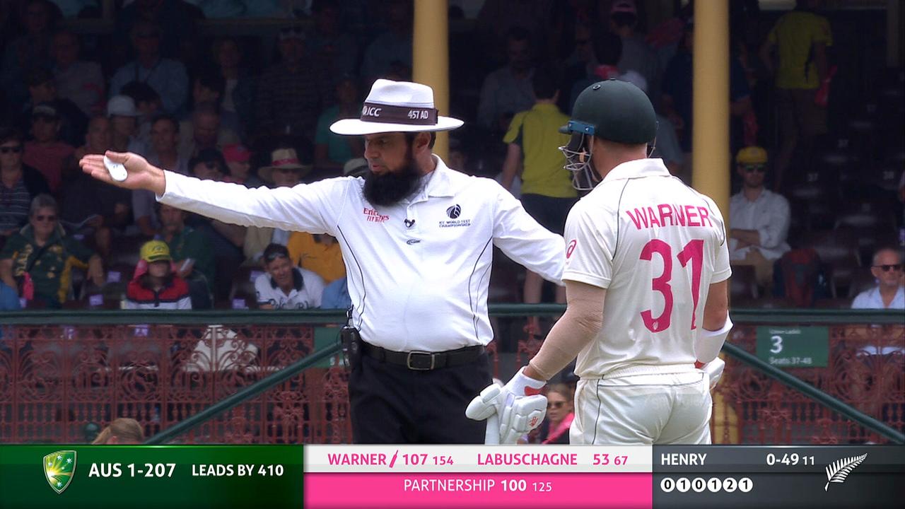 David Warner was stunned as umpire Aleem Dar penalised him for a rare infringement.