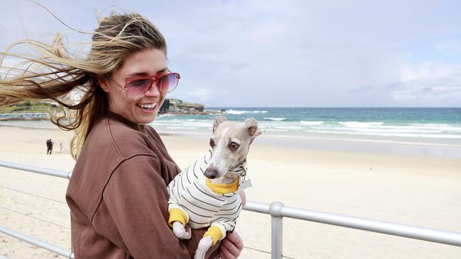 Make the most of the sun this spring and summer like Lavinia White with her dog Quinn, with La Nina expected for the third year in a row. Picture: Tim Hunter.