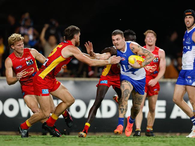 Cam Zurhaar attempts to break a tackle on Saturday night. Picture: Dylan Burns/AFL Photos