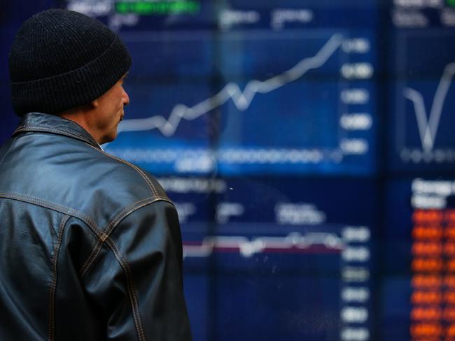 SYDNEY, AUSTRALIA - NewsWire Photos JULY 05, 2021: A member of the public is seen checking the stocks at the ASX in the CBD, as we enter week 2 of Covid-19  lockdown in Sydney Australia. Picture: NCA NewsWire / Gaye Gerard