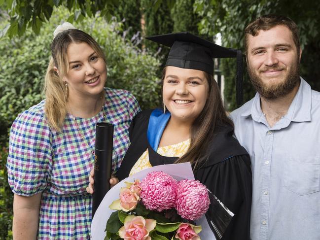 Bachelor of Nursing graduate Annabelle McAdam with sister Lauren McAdam and partner Mitchell Hansen at a UniSQ graduation ceremony at Empire Theatres, Tuesday, February 13, 2024. Picture: Kevin Farmer