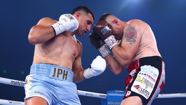 GOLD COAST, AUSTRALIA - JANUARY 08: Justis Huni punches Shaun Potgieter during the IBF Pan-Pacific, WBO Global heavyweight title at the Gold Coast Convention Centre on January 08, 2025 in Gold Coast, Australia. (Photo by Chris Hyde/Getty Images)