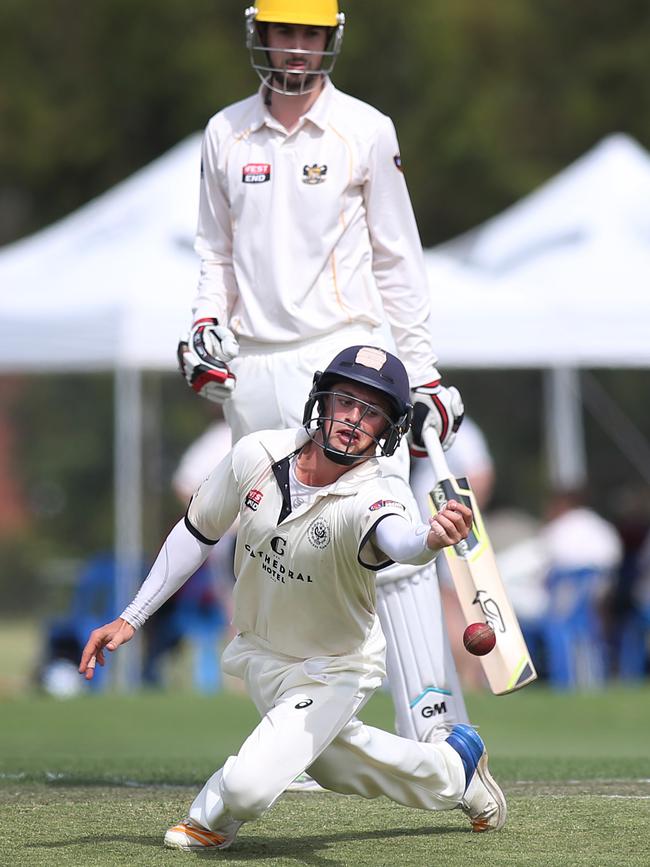 Adelaide Uni's James McCollum got so close put put down a difficult chance off Glenelg's Harry Cunningham. Picture: AAP/Dean Martin