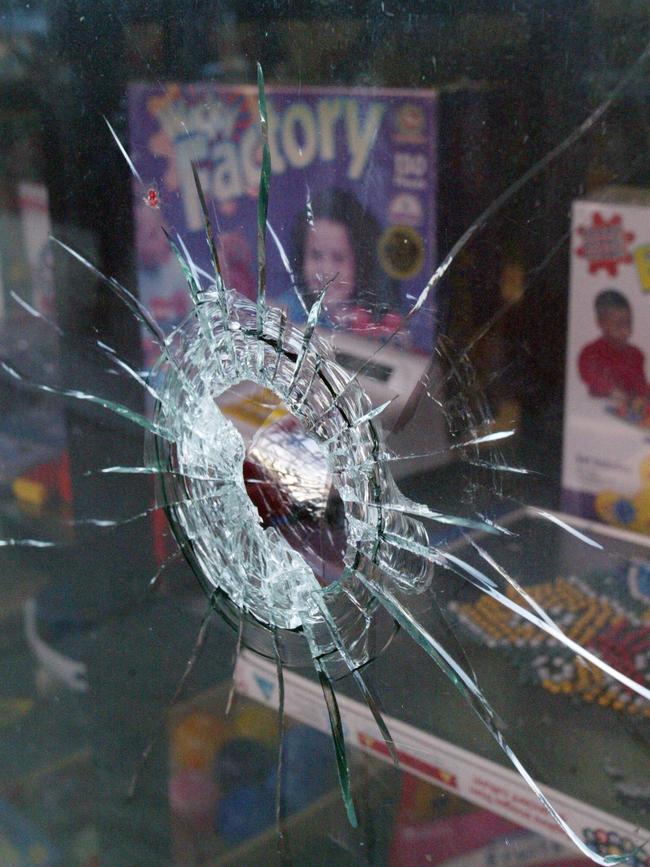 A bullet hole in a shop window from the shooting of Willie Thompson.