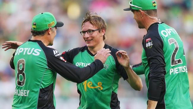 Debutant Liam Bowe of the Stars celebrates the wicket of Ben Dunk with David Hussey and Kevin Pietersen. Picture: Michael Dodge/Getty Images.