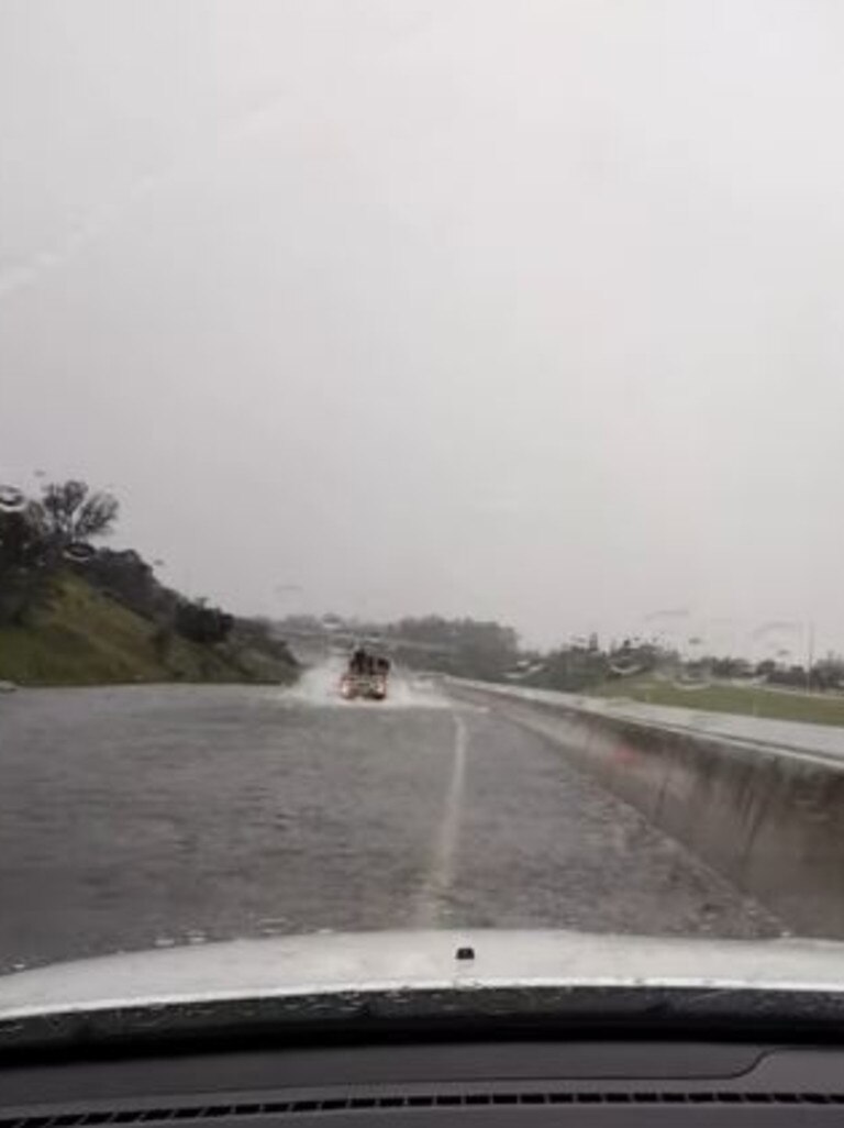 A vehicle tries to navigate the M1 south of Gympie.