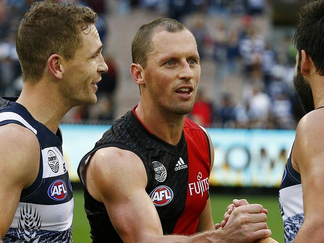 James Kelly shakes hands with former temmate Jimmy Bartel after the game. Picture: Wayne Ludbey