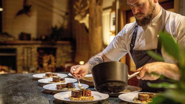 Chef Phillip Blackburne serves pork fillet with a basil-olive mousse, roasted cauliflower and caper sauce. Photography by Camilla Rutherford.