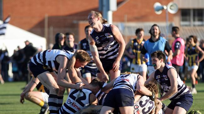 Riddell District Football League Grand Final between Macedon and Rupertswood. Macedon 11.14 (80) defeated Rupertswood 10.7 (67). Macedon players celebrate at the final siren after winning it's first senior premiership since 1976. Picture: Aaron Cook