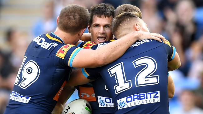 Gold Coast winger Anthony Don celebrates with teammates after scoring a try against Newcastle during their Round 6 clash. Picture: Bradley Kanaris