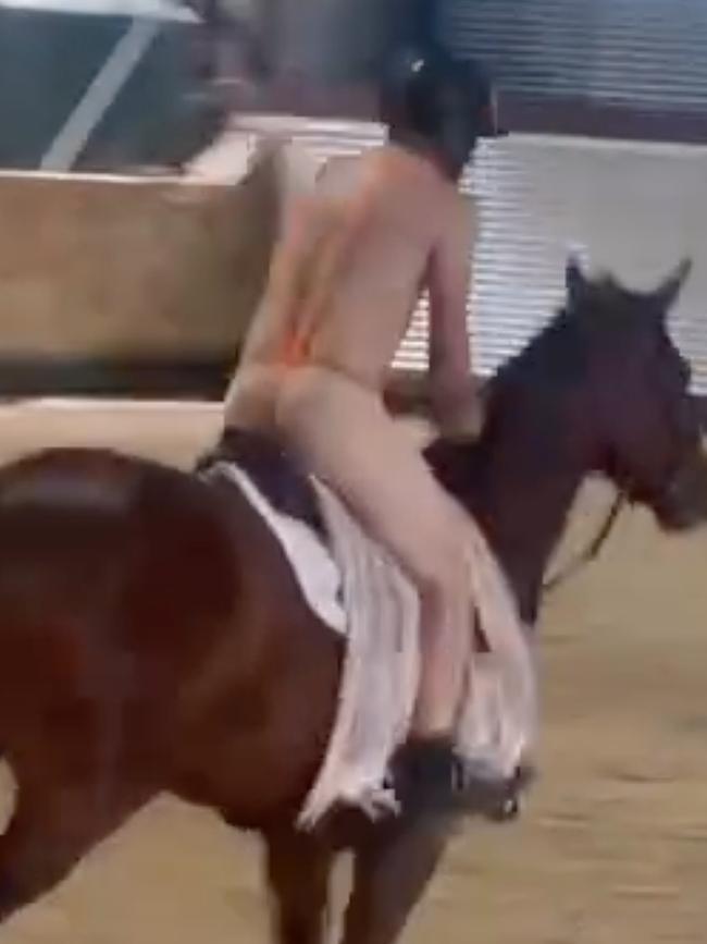 Shane Rose sporting a mankini on horseback.