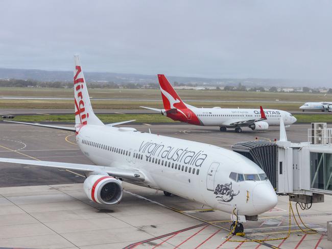 ADELAIDE, AUSTRALIA - NewsWire Photos SEPTEMBER 22, 2021: Virgin, Qantas and Cobham aircraft at Adelaide Airport. Picture: NCA NewsWire /Brenton Edwards